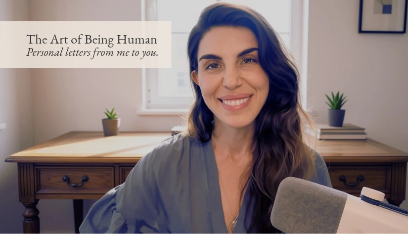 The Art of Being Human. Personal letters from me to you. Brandy Nielson smiling at her desk.